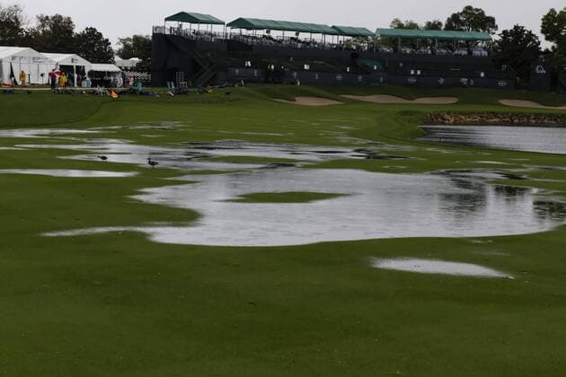 March 24, 2013 - Orlando, Florida, U.S - Ducks walk in the water on the 18th fairway during the rain delay on the final round of the Arnold Palmer Invitational at the Bay Hill Club and Lodge. Golf 2013 - Arnold Palmer Invitational - Final Round  - ZUMAr11