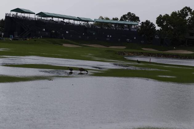 March 24, 2013 - Orlando, Florida, U.S - Ducks walk in the water on the 18th fairway during the rain delay on the final round of the Arnold Palmer Invitational at the Bay Hill Club and Lodge. Golf 2013 - Arnold Palmer Invitational - Final Round  - ZUMAr11