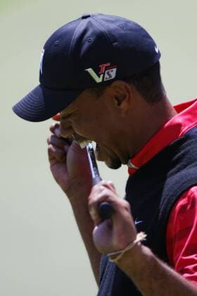 March 25, 2013 - Orlando, Florida, U.S - TIGER WOODS bites his putter on the 18th green during the final round of the Arnold Palmer Invitational at the Bay Hill Club and Lodge. Golf 2013 - Arnold Palmer Invitational - Final Round  - ZUMAr11