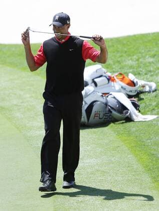March 24, 2013 - Orlando, FL, USA - Tiger Woods bites his club after missing his putt for par on the 18th green of the final round of the Arnold Palmer Invitational in Orlando, Florida, Monday, March 25, 2013. Woods won his eighth tournament at Bay Hill. Arnold Palmer Invitational - ZUMAm67