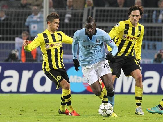 04.12.2012, UEFA Champions League, Borussia Dortmund - Manchester City v.l. Moritz Leitner (Borussia Dortmund), Mario Balotelli (Manchester City FC), Mats Hummels (Borussia Dortmund)