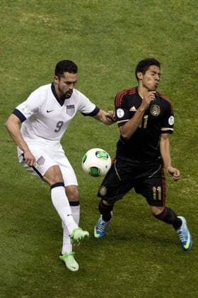 MEXICO CITY, March 26, 2013 - Mexico s Javier Aquino (R) vies with Herculez Gomez (L) of the U.S. during a CONCACAF s qualifying match for Brazil s World Cup 2014 at Azteca Stadium, in Mexico City, capital of Mexico, on March 26, 2013. (Xinhua Rodrigo Oropeza) (da) (sp) MEXICO-MEXICO CITY-SOCCER-MEXICO VS U.S. 