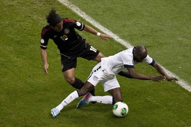 MEXICO CITY, March 26, 2013 - Mexico s Giovani Dos Santos (L) vies with DaMarcus Beasley (R) of the U.S. during a CONCACAF s qualifying match for Brazil s World Cup 2014 at Azteca Stadium, in Mexico City, capital of Mexico, on March 26, 2013. (Xinhua Rodrigo Oropeza) (da) (sp) MEXICO-MEXICO CITY-SOCCER-MEXICO VS U.S. 