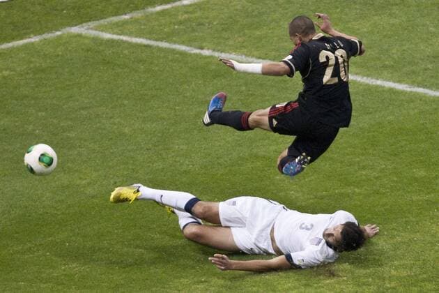 MEXICO CITY, March 26, 2013 - Mexico s Jorge Torres Nilo (up) vies with Omar Gonzalez (down) of the U.S. during a CONCACAF s qualifying match for Brazil s World Cup 2014 at Azteca Stadium, in Mexico City, capital of Mexico, on March 26, 2013. (Xinhua Rodrigo Oropeza) (da) (sp) MEXICO-MEXICO CITY-SOCCER-MEXICO VS U.S. 