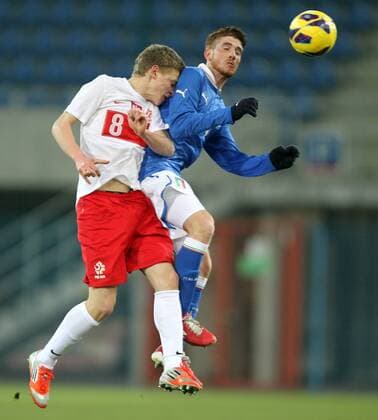GLIWICE 27.03.2013 FOOTBALL 12TH FOUR NATIONS TOURNAMENT POLAND U20 - ITALY U20 - MATEUSZ SZWOCH POL, GIANLUCA SAMPIETRO ITA -  130327MIN028