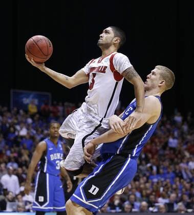 March 31, 2013 - Indianapolis, IN, USA - Louisville guard Peyton Siva (3) goes past Duke forward Mason Plumlee (5) in second half action in the NCAA College League USA regional final game on Sunday, March 31, 2013, in Indianapolis, Indiana. Louisville won the game 85-63. (Sam Riche MCT)in the NCAA College League USA regional final game on Sunday, March 31, 2013, in Indianapolis, Indiana. Louisville won the game 85-63. Louisville VS. Duke - ZUMAm67