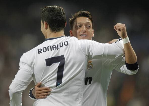 Real Madrid s Cristiano Ronaldo celebrates with Mesut Özil during UEFA Champions League match. April 03, 2013.  (1581015)