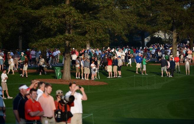 Range workers wait for golfers during a practice round before the Masters golf tournament at Augusta National Golf Club on April 8, 2013 in Augusta, Georgia. The 77th Masters tournament will begin on Thursday.  AUG20130408315