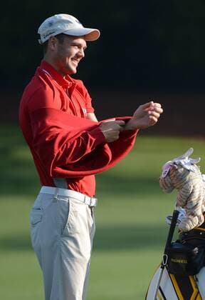 Martin Kaymer of Germany changes shirts on the driving range during a practice round before the Masters golf tournament at Augusta National Golf Club on April 8, 2013 in Augusta, Georgia. The 77th Masters tournament will begin on Thursday.  AUG20130408311