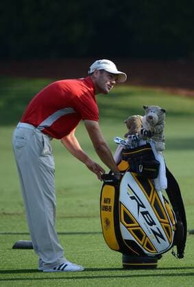 Martin Kaymer of Germany goes into his bag on the driving range during a practice round before the Masters golf tournament at Augusta National Golf Club on April 8, 2013 in Augusta, Georgia. The 77th Masters tournament will begin on Thursday.  AUG20130408310