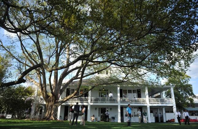 The club house is seen under the big oak tree at the Master golf tournament at Augusta National Golf Club on April 8, 2013 in Augusta, Georgia.  AUG20130408333