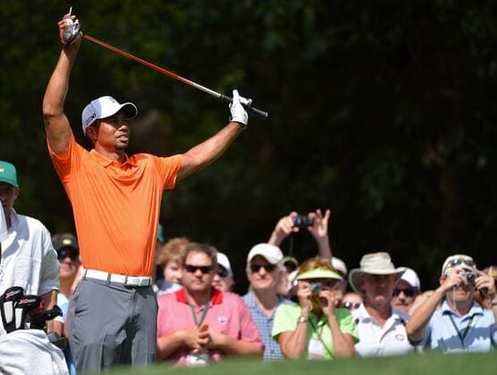 Tiger Woods stretches on the 10th tee during a practice round before the Master golf tournament at Augusta National Golf Club on April 8, 2013 in Augusta, Georgia.  AUG20130408355