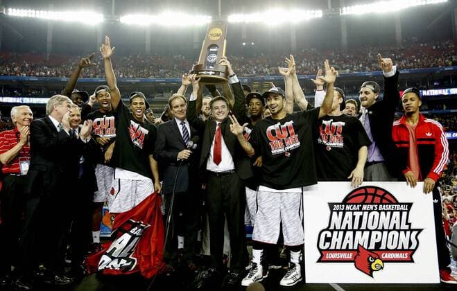 April 8, 2013 - Atlanta, GA, USA - Louisville Cardinals head coach Rick Pitino celebrates with his team after defeating Michigan, 82-76, and winning the NCAA College League USA Men s Basketball Championship at the Georgia Dome in Atlanta, Georgia, Monday, April 8, 2013. Final Four - ZUMAm67