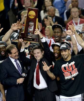 April 8, 2013 - Atlanta, GA, USA - Louisville Cardinals head coach Rick Pitino hoists the trophy after defeating Michigan 82-76 in the NCAA College League USA Men s Basketball Championship at the Georgia Dome in Atlanta, Georiga, Monday, April 8, 2013. Final Four - ZUMAm67