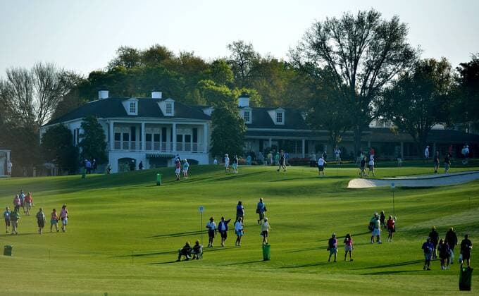 Golf patrons move through the course during a practice round before the Master golf tournament at Augusta National Golf Club on April 9, 2013 in Augusta, Georgia.  AUG20130409309
