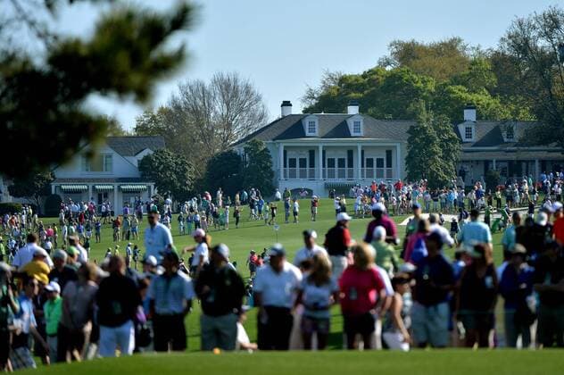 Golf patrons move through the course during a practice round before the Master golf tournament at Augusta National Golf Club on April 9, 2013 in Augusta, Georgia.  AUG20130409319