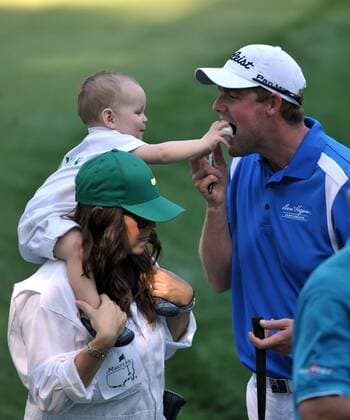 Marc Leishman s son Harvey puts a golf ball into his fathers mouth during the Masters Par 3 Contest, a day before the beginning of the Masters tournament, at Augusta National, on April 10, 2013 in Augusta, Georgia.  AUG20130410332