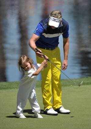 Luke Donald tries to have his daughter Sophia hold a putter during the Masters Par 3 Contest, a day before the beginning of the Masters tournament, at Augusta National, on April 10, 2013 in Augusta, Georgia.  AUG20130410349