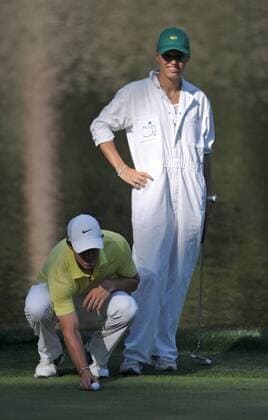 Rory McIlroy and his girlfriend Caroline Wozniacki line up a putt on the 9th green during the Masters Par 3 Contest a day before the beginning of the Masters tournament at Augusta National, on April 10, 2013 in Augusta, Georgia.  AUG20130410316