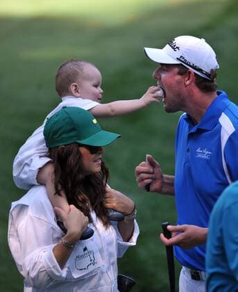 Marc Leishman s son Harvey puts a golf ball into his fathers mouth during the Masters Par 3 Contest, a day before the beginning of the Masters tournament, at Augusta National, on April 10, 2013 in Augusta, Georgia.  AUG20130410333