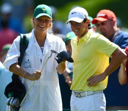 April 10, 2013 - Augusta, Georgia, U.S. - RORY MCILROY, right, smiles with his caddie girlfriend CAROLINE WOZNIACKI at the 1st green during the Par 3 Contest at the Masters at Augusta National Golf Club. Golf 2013 - Masters Tournament - Par 3 Contest - ZUMAm67
