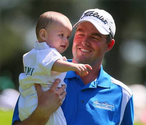 April 10, 2013 - Augusta, GA, USA - Australia s Marc Leishman carries his 15-month-old son, Harvey, down the 1st fairway during the Par 3 Contest at the Masters at Augusta National Golf Club on Wednesday, April 10, 2013, in Augusta, Georgia. Masters at Augusta National Golf Club - ZUMAm67