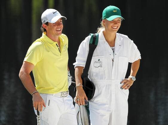April 10, 2013 - Augusta, GA, USA - Rory McIlroy shares a laugh with his girlfriend, tennis player Caroline Wozniacki, on the 4th hole while she caddies for him during the Par 3 Contest at the Masters at Augusta National Golf Club on Wednesday, April 10, 2013, in Augusta, Georgia. Masters at Augusta National Golf Club - ZUMAm67