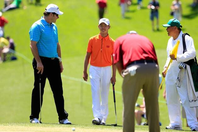 (130411) -- AUGUSTA, April 10, 2013 (Xinhua) -- China s Guan Tianlang (2nd L) walks to the No. 1 green during the Par 3 Contest for the 2013 Masters at the Augusta National Golf Club in Augusta, Georgia, the United States, on April 10, 2013. (Xinhua Chris Trotman Augusta National) (zf) U.S.-AUGUSTA-2013 MASTERS-PAR 3 CONTEST-CHINA-GUAN TIANLANG 
