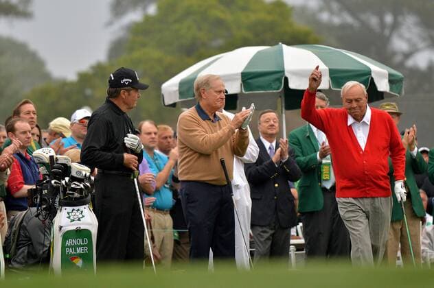 Honorary starters, Gary Player (L) and Jack Nicklaus (C) clap as fellow starter Arnold Palmer (R) is introduced as they officially start the 2013 Masters at Augusta National on April 11, 2013 in Augusta, Georgia.  AUG20130411311