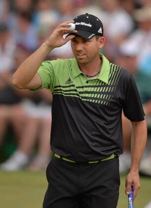 Sergio Garcia tips his hat as he walks off the 18th green during the first round of the Masters at Augusta National on April 11, 2013 in Augusta, Georgia.  AUG20130411369