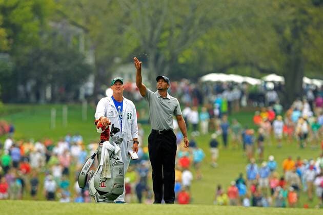 (130412) -- AUGUSTA, April 11, 2013 (Xinhua) -- Tiger Woods (R) of the United States attends the first round of the 2013 Masters golf tournament at the Augusta National Golf Club in Augusta, Georgia, the United States, April 11, 2013. Woods shot a two-under par 70 on Thursday. (Xinhua Charles Laberge Augusta National) U.S.-AUGUSTA-GOLF-2013 MASTERS 