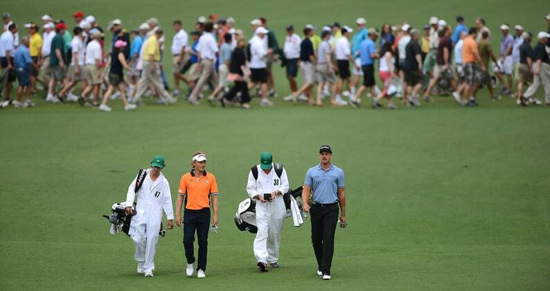 April 12, 2013 - Augusta, GA, USA - From left, caddie Terry Holt (47), golfer Bernhard Langer, caddie Gareth Bryn Lord (38) and golfer Henrik Stenson walk down the second fairway as fans cross in the background at Augusta National Golf Club during second round action of the Masters Tournament at Augusta National Golf Club, Friday, April 12, 2013, in Augusta, Georgia. Masters Tournament at Augusta National - ZUMAm67