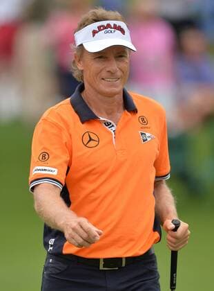 Bernhard Langer smiles after making a putt for eagle on the 2nd green during the second round of the Masters at Augusta National on April 12, 2013 in Augusta, Georgia.  AUG20130412308