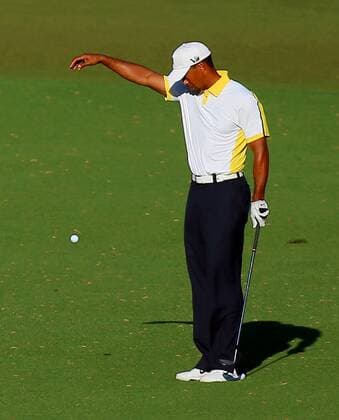 April 12, 2013 - Augusta, GA, USA - Tiger Woods takes a drop on the 15th hole after hitting into the water during the second round of the Masters at Augusta National Golf Club, Friday, April 12, 2013, in Augusta, Georgia. Masters Tournament at Augusta National - ZUMAm67