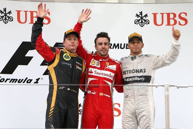 (130414) -- SHANGHAI, April 14, 2013 (Xinhua) -- Ferrari driver Fernando Alonso of Spain (C) celebrates on the podium after winning the Formula One Chinese Grand Prix with second-placed Lotus driver Kimi Raikkonen of Finland (L) and third-placed Mercedes driver Lewis Hamilton of Britain (R) at the Shanghai International circuit, in Shanghai, east China, on April 14, 2013. (Xinhua Fan Jun) CHINA-SHANGHAI-F1 (CN) 