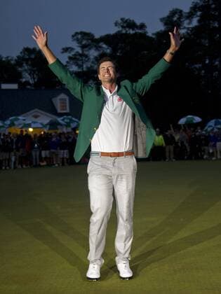 Adam Scott celebrates after receiving the green jacket after winning the 2013 Masters at Augusta National on April 14, 2013 in Augusta, Georgia. Scott defeated Angel Cabrera on a 10th hole playoff.  AUG20130414318