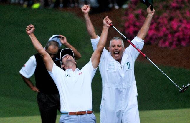Adam Scott, caddie Steve Williams and Angel Cabrera react when Scott sinks a birdie putt on the second hole of a sudden-death playoff in the fourth round of the Masters at Augusta National on April 14, 2013 in Augusta, Georgia. Adam Scott defeated Angel Cabrera on the second playoff hole to become the first Australian to win a Green Jacket.  AUG20130414585