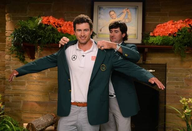 AUGUSTA, April 14, 2013 -- Adam Scott (Front) of Australia celebrates his 2013 Masters win with the ceremonial green jacket after the fourth round of the 2013 Masters golf tournament at the Augusta National Golf Club in Augusta, Georgia, the United States, April 14, 2013. Scott finished the tournament at nine-under par 279 and claimed the title after a playoff. (Xinhua Rusty Jarrett Augusta National) U.S.-AUGUSTA-GOLF-2013 MASTERS 