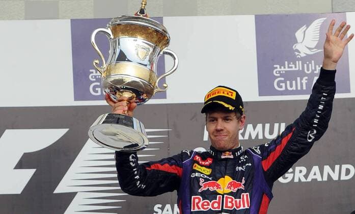 (130421) -- MANAMA, April 21, 2013 (Xinhua) -- Red Bull driver Sebastian Vettel celebrates with the winner s trophy during the victory ceremony of the Bahrain F1 Grand Prix at the Bahrain International Circuit in Manama, Bahrain, on April 21, 2013. (Xinhua Chen Shaojin) (zf) BAHRAIN-MANAMA-F1 