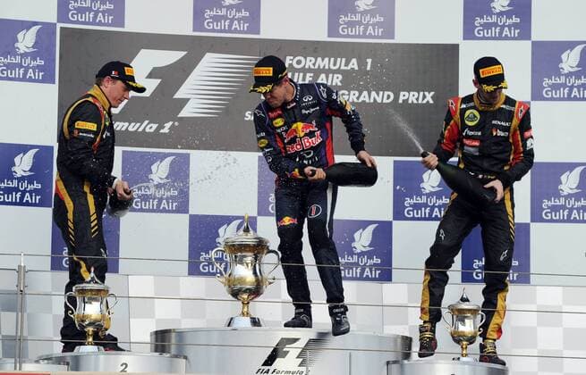 (130421) -- MANAMA, April 21, 2013 (Xinhua) -- Red Bull driver Sebastian Vettel (C), Lotus driver Kimi Raikkonen (L) and Lotus driver Romain Grosjean celebrate during the victory ceremony of the Bahrain F1 Grand Prix at the Bahrain International Circuit in Manama, Bahrain, on April 21, 2013. (Xinhua Chen Shaojin) (zf) BAHRAIN-MANAMA-F1 