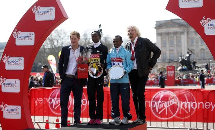 (130421) -- LONDON, April 21, 2013 (Xinhua) -- Prince Harry (1st L) and Sir Richard Branson (1st R), chairman of Virgin Group pose with Men Elite Race champion Tsegaye Kebede (2nd R) and Women Elite Race champion Priscah Jeptoo during the awarding ceremony for 2013 London Marathon in London, Britain on April 21, 2013. (Xinhua Wang Lili)(zf) BRITAIN-LONDON-MARATHON 