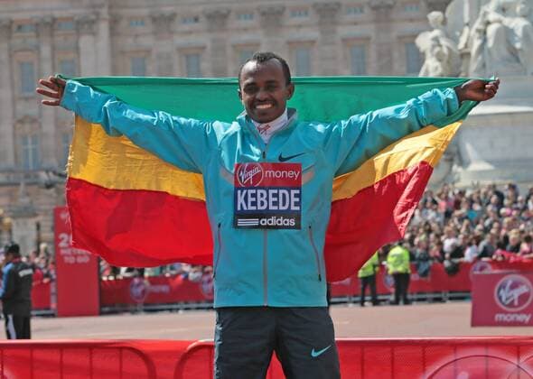 Ethiopia s Tsegaye Kebede celebrates winning the 2013 London Marathon in a time of 2:06:04 on April 21 2013.It is Kebede s second triumph at the London Marathon.  LON2013042112