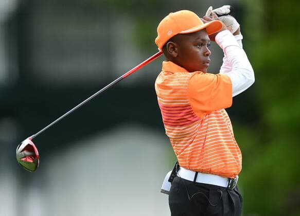 May 1, 2013 - Charlotte, NC, USA - Reyhan Griffin, 14, watches his drive from the 15th tee during the Pro-Am at Quail Hollow Club ahead of the Wells Fargo Championship in Charlotte, North Carolina, on Wednesday, May 1, 2013. Wells Fargo Championship - ZUMAm67
