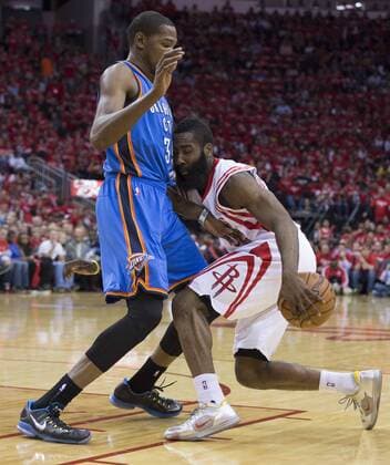 May 3, 2013 - Houston, TX, USA - James Harden (13) of the Houston Rockets hits the defense of Kevin Durant (35) of the Oklahoma City Thunder in the first half of their Western Conference playoff game on Friday, May 3, 2013, in Houston, Texas. OKLAHOMA CITY THUNDER VS. HOUSTON ROCKETS - ZUMAm67
