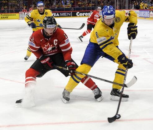 Stockholm 2013 05 0 Ice-Hockey World Championship 2013 - Sweden SWE vs Canada CAN - Pictures shows Eric Staal CAN 12 and Petter Granberg SWE 8 - KPkod 08002 