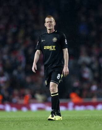Wigan s Ben Watson looks on dejected at the final whistle - Barclays Premier League - Arsenal vs Wigan - Emirates Stadium - London - 14 05 2013 - Pic David Klein Sportimage EDITORIAL USE ONLY. No use with unauthorised audio, video, data, fixture lists, club league logos or live services. Online in-match use limited to 120 images, no video emulation. No use in betting, games or single club league player publications.