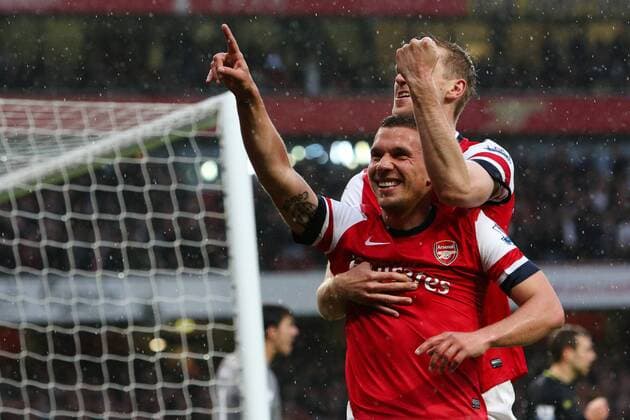 Football - 2012 2013 Premier League - Arsenal vs Wigan Lukas Podolski of Arsenal celebrates scoring his team s 1st goal at the Emirates Stadium, London 