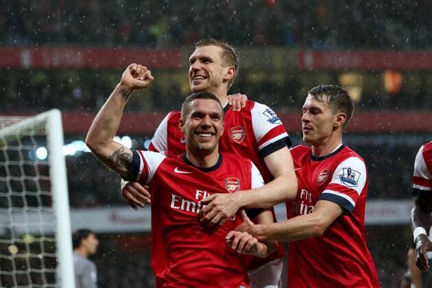 Football - 2012 2013 Premier League - Arsenal vs Wigan Lukas Podolski of Arsenal celebrates scoring his team s 1st goal at the Emirates Stadium, London 