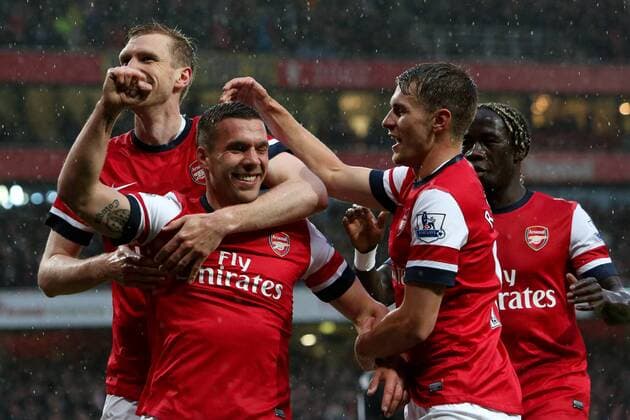 Football - 2012 2013 Premier League - Arsenal vs Wigan Lukas Podolski of Arsenal celebrates scoring his team s 1st goal at the Emirates Stadium, London 