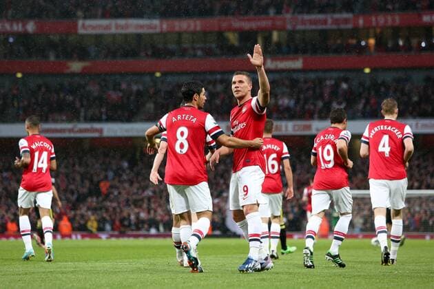 Football - 2012 2013 Premier League - Arsenal vs Wigan Lukas Podolski of Arsenal celebrates scoring his team s 1st goal at the Emirates Stadium, London 